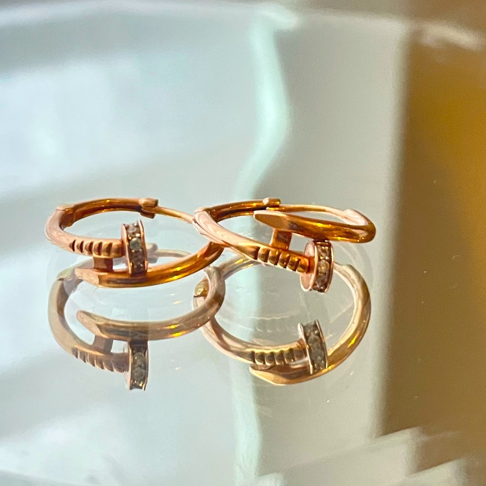 Rose gold earrings with moissanite gems